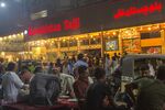 Diners outside a restaurant in Karachi.