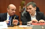 Greece's Finance Minister Euclid Tsakalotos (R) and Spanish Finance Minister Luis de Guindos Jurado talk during an Eurogroup meeting at the EU headquarters in Brussels, on Aug. 14.