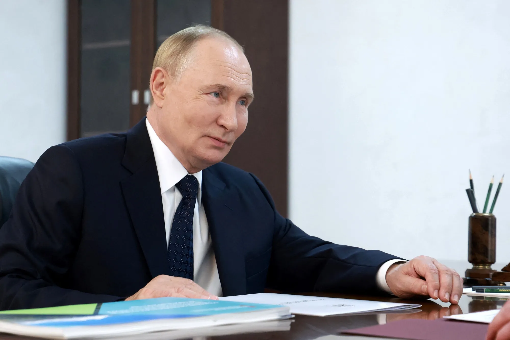 In this pool photograph distributed by Russian state owned Sputnik agency, Vladimir Putin meets with head of the Kabardino-Balkarian Republic on Aug. 20.