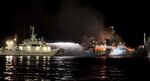 A Philippine Coast Guard ship tries to extinguish fire on the MV Lady Mary Joy at Basilan, early on&nbsp;March 30.