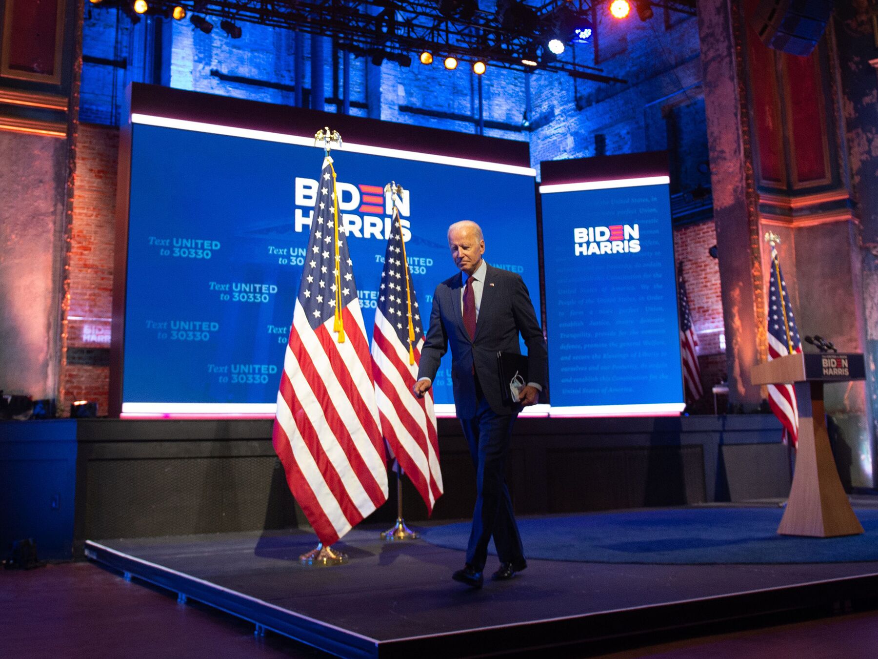 Joe Biden leaves the stage after speaking at a local theater in Wilmington, Delaware on September 27, 2020.