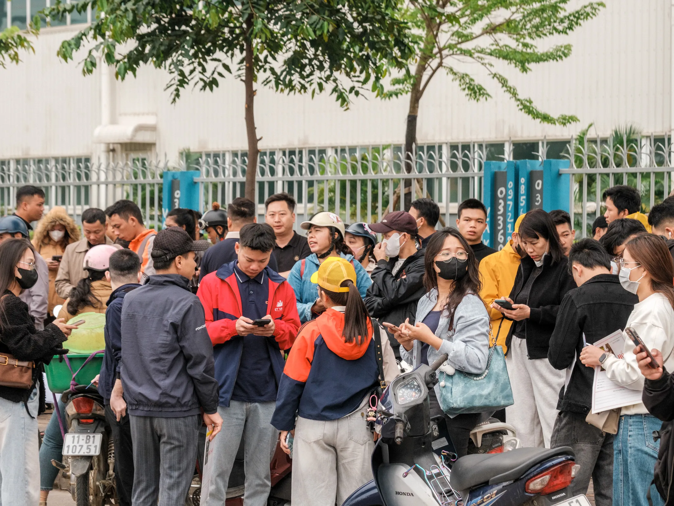 Job applicants line up outside a Foxconn Technology Group factory.