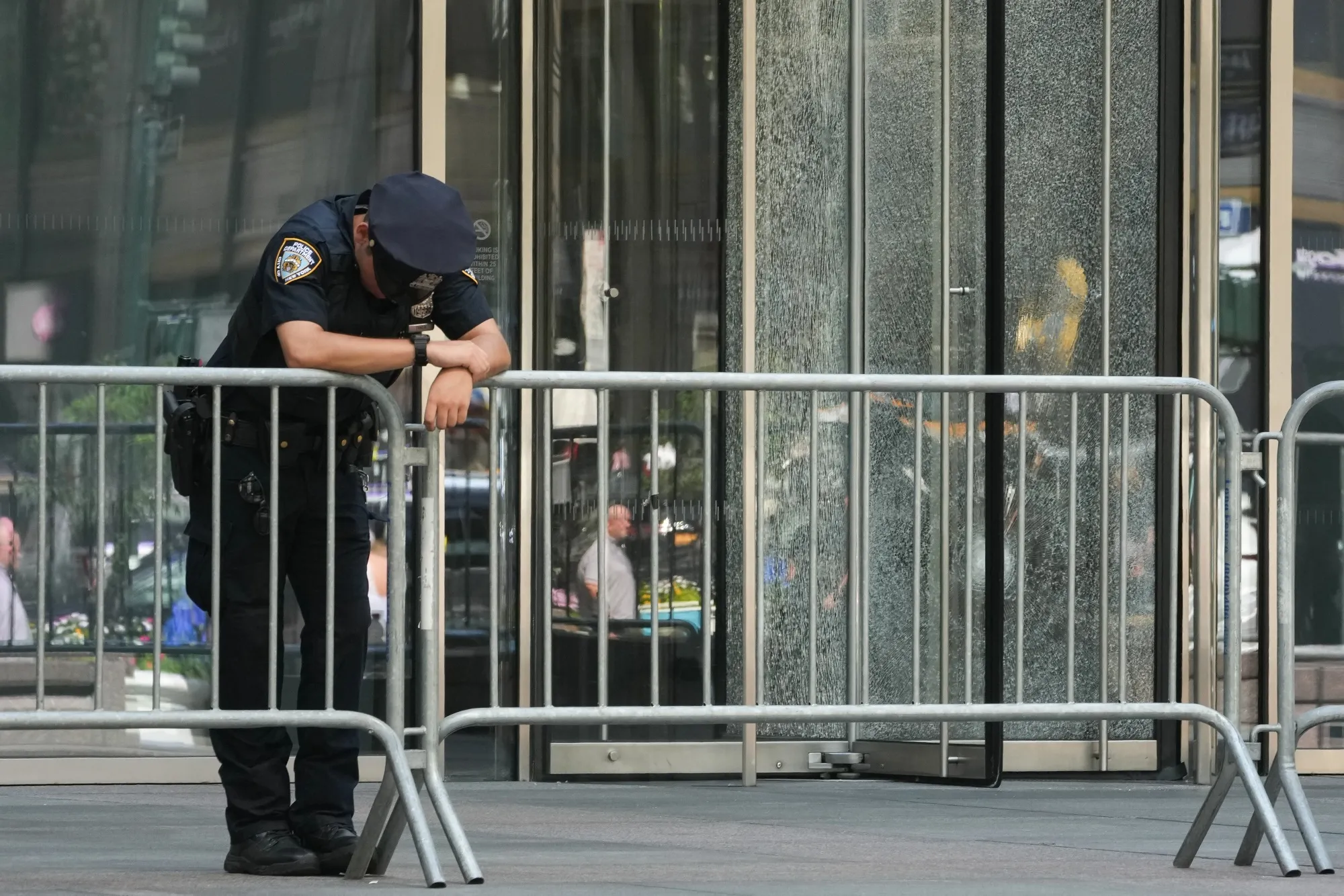 A New York City Police Department (NYPD) officer&nbsp;outside the building at 345 Park Avenue in New York on July 29.