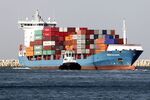 Container ship “Irem Kalkavan” is guided by a tugboat as it arrives at the Port of Haifa in Israel