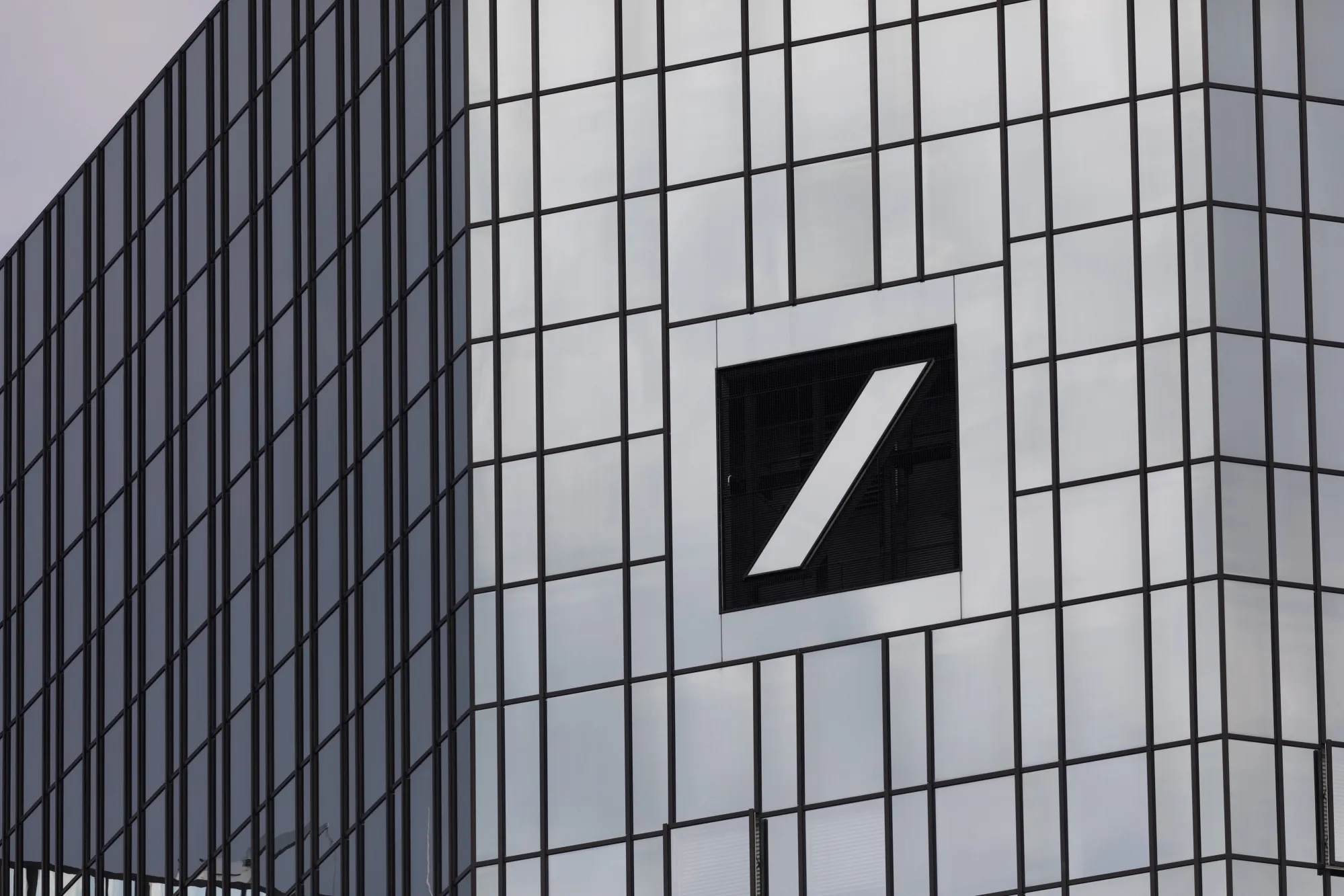 The Deutsche Bank AG logo sits on the bank's headquarters in Frankfurt, Germany, on Wednesday, July 25, 2018. Deutsche Bank vowed to maintain its position in fixed-income trading after recording its weakest second quarter in that business since the global financial crisis, as Chief Executive Officer Christian Sewing accelerates the lender’s turnaround effort.