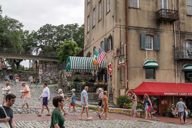 People are seen outside The Boar's Head grill and tavern, a former cotton factory, in Savannah.