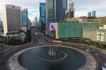 Vehicles circle a roundabout during a partial lockdown in Jakarta on May 27.