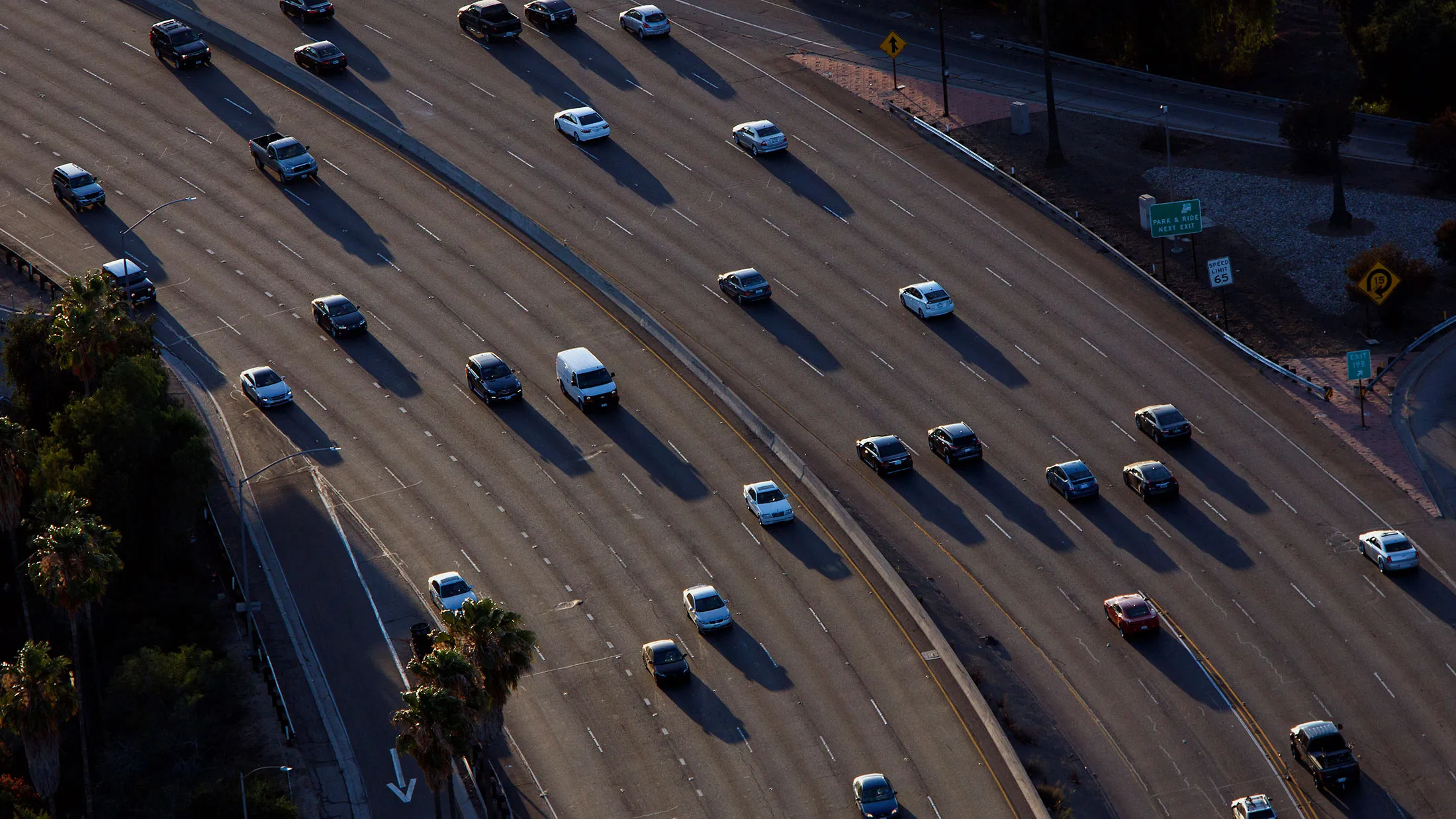 Vehicles move slowly in rush-hour traffic on the US 101 freeway in this aerial photograph taken over the Sherman Oaks neighborhood of Los Angeles on July 10, 2015.
