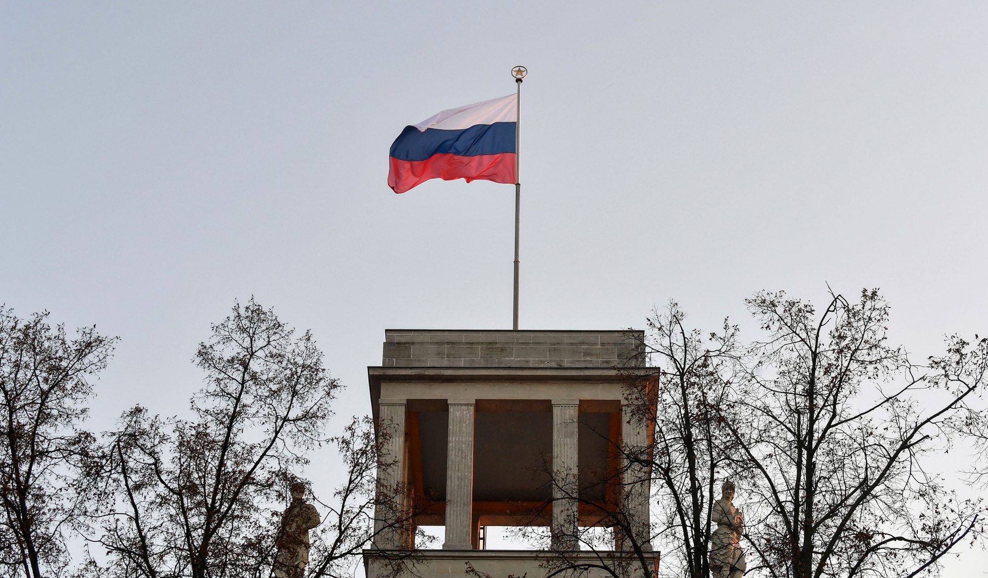 The Russian flag flies on the roof of the Russian embassy in Berlin.