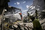 Firefighters extinguish a blaze at a Gypsum Manufactory plant after shelling in the city of Bakhmut, Ukraine, on May 27