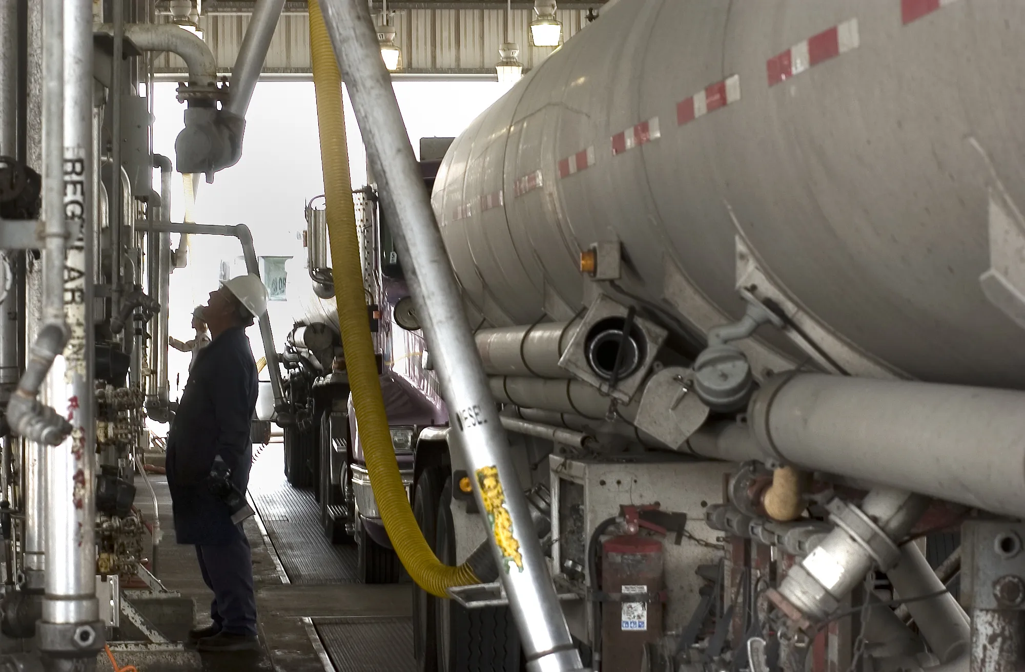 Tanker truck drivers fill up with gasoline or diesel fuel at Valero Corpus Christi, Texas.
