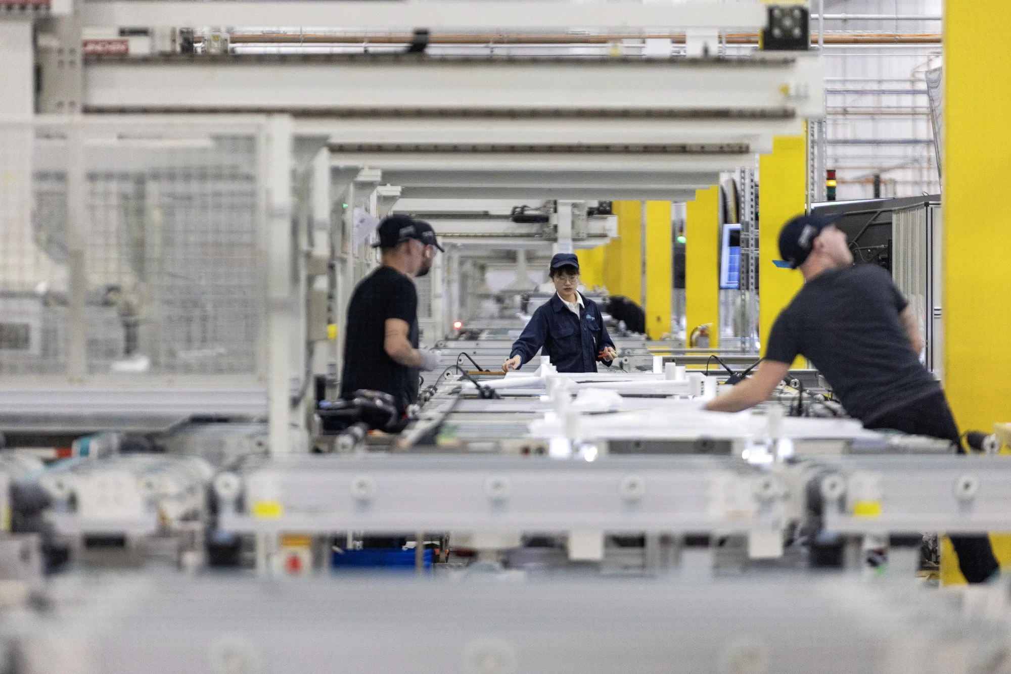 Workers at the Illuminate solar plant in Pataskala, Ohio.