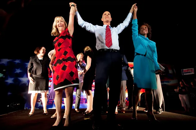 Then-candidate for governor Rick Scott greets supporters with his wife, Ann, left, and running mate Jennifer Carroll at a post-debate rally in Tampa in 2010