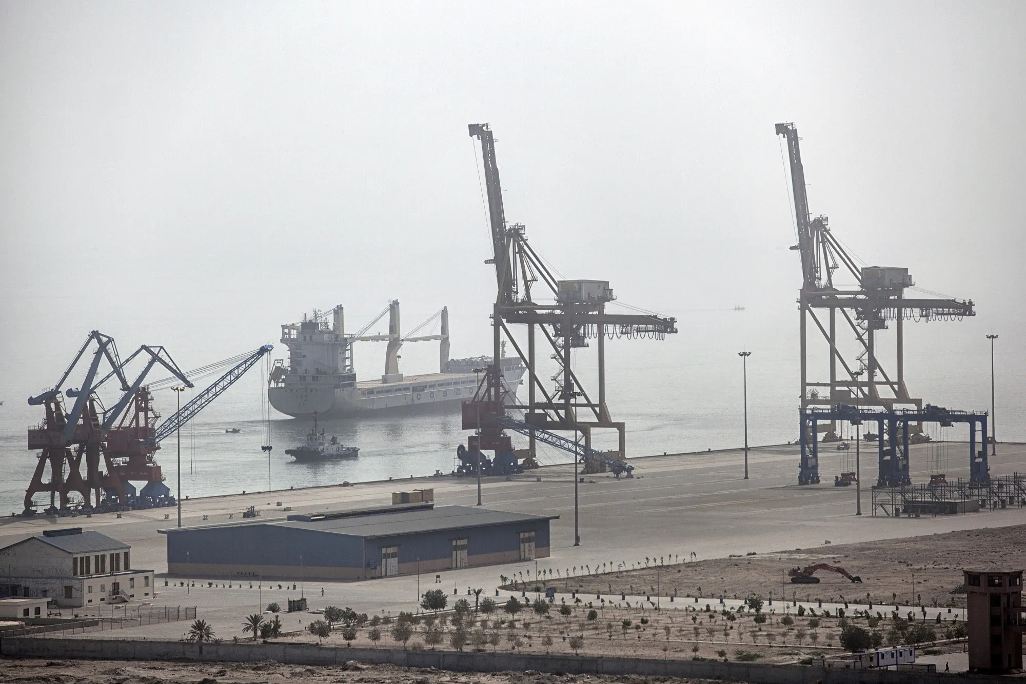 A cargo ship sits at Gwadar Port in Gwadar, Pakistan, on Tuesday, Aug. 2, 2016.
