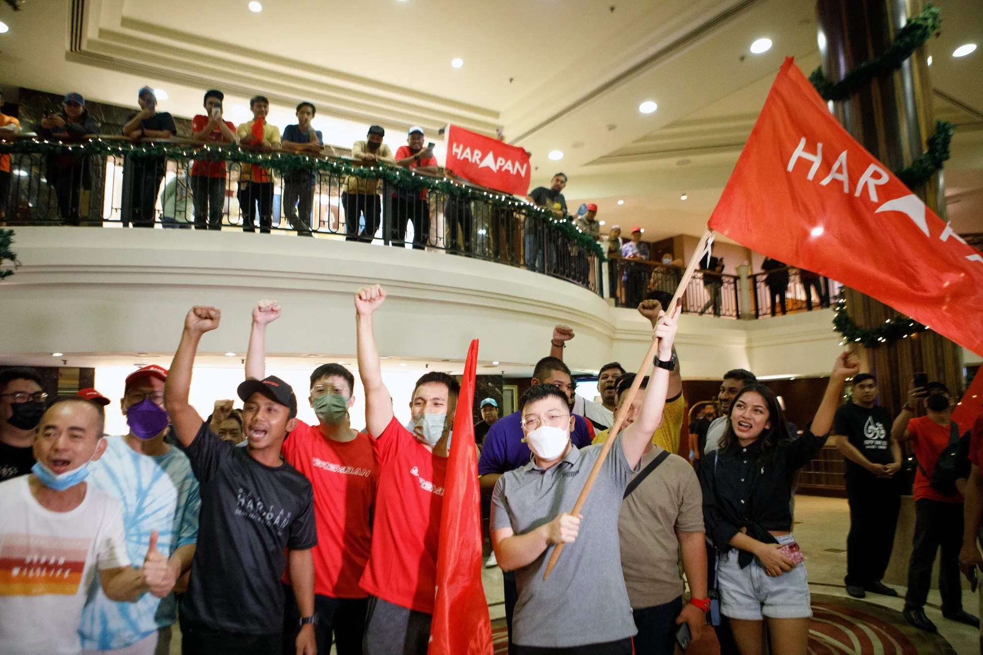 Supporters of the Pakatan Harapan (PH) cheer at an election event in Subang, on Nov. 20.
