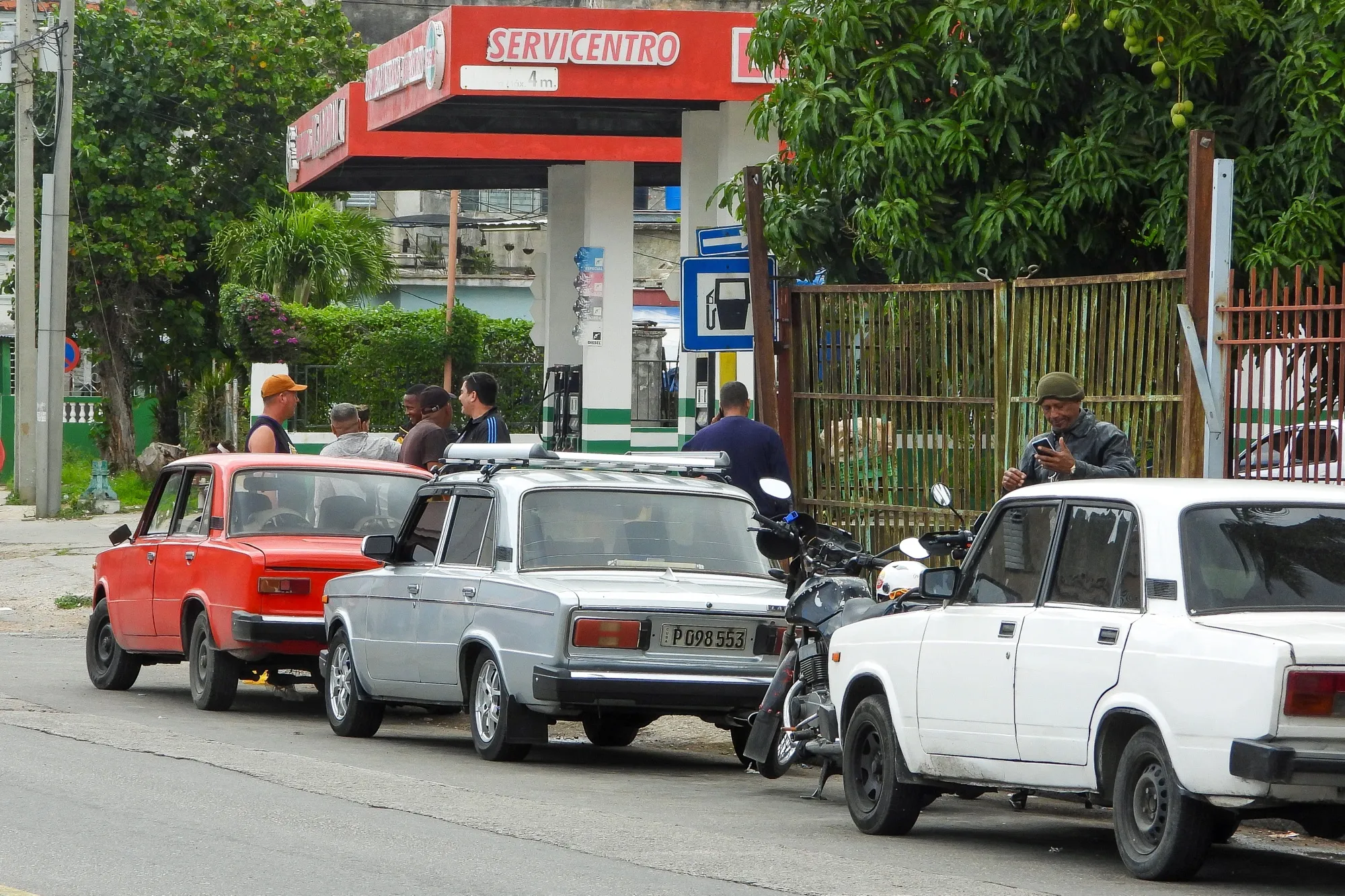Vehicles wait in line a gas station in Havana on Jan. 30.