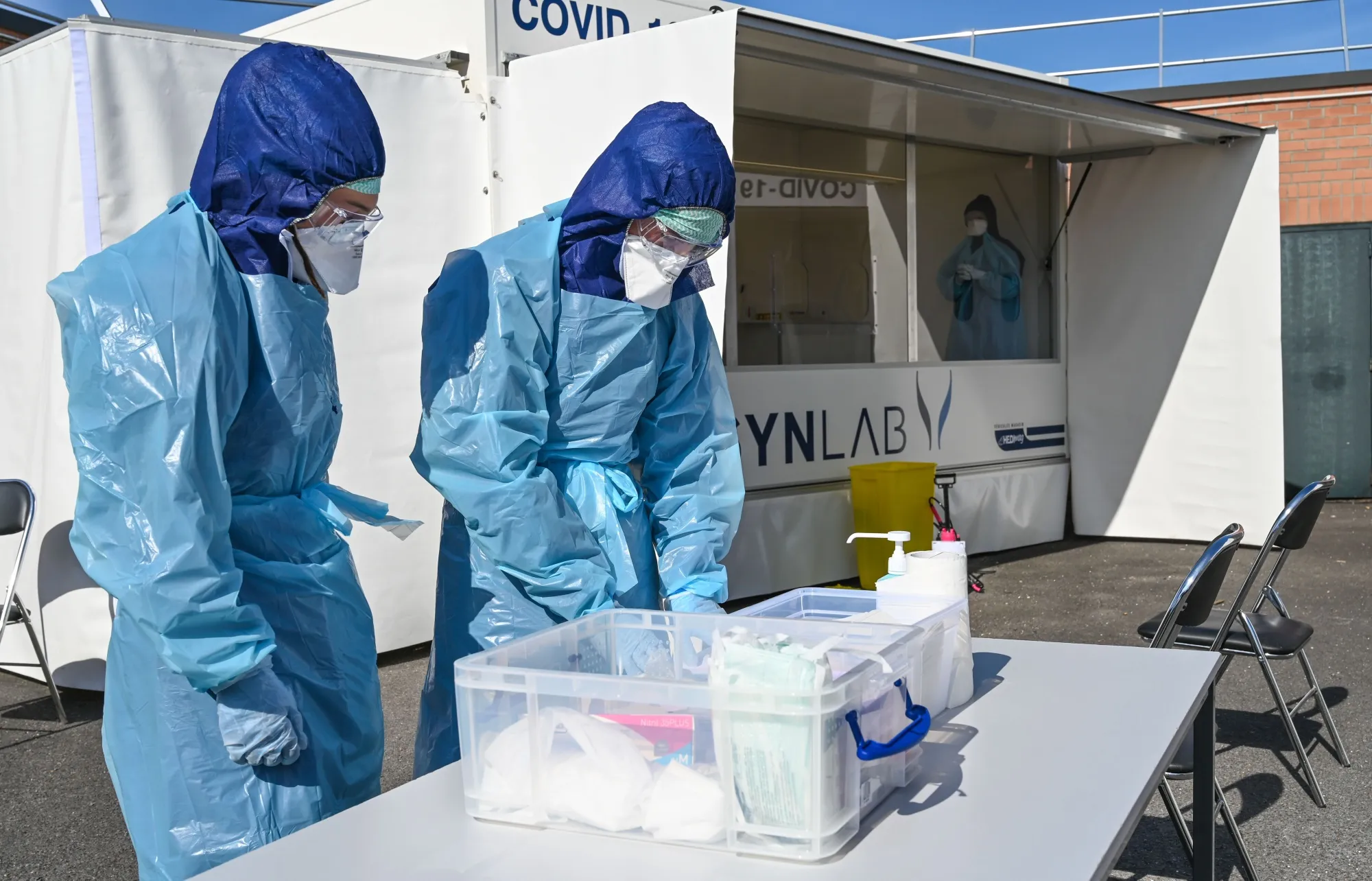 Biologists of the Synlab laboratory prepare to collect samples at a COVID-19 coronavirus testing center&nbsp;in Lens, France in May 2020.&nbsp;