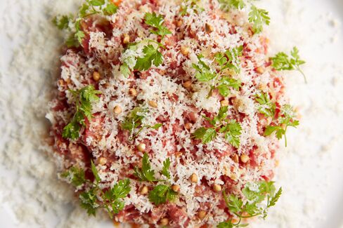 The beef tartare, under a snow of smoked cheddar, is exquisite.