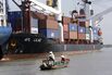 A sampan sails near to a newly built con