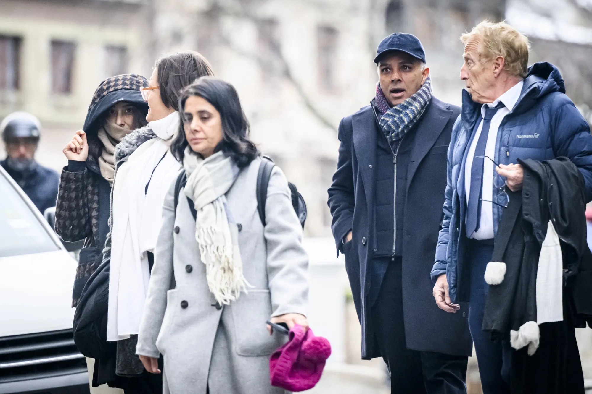 Namrata Hinduja, left, and Ajay Hinduja, second right, at the courthouse in Geneva on Jan. 15.