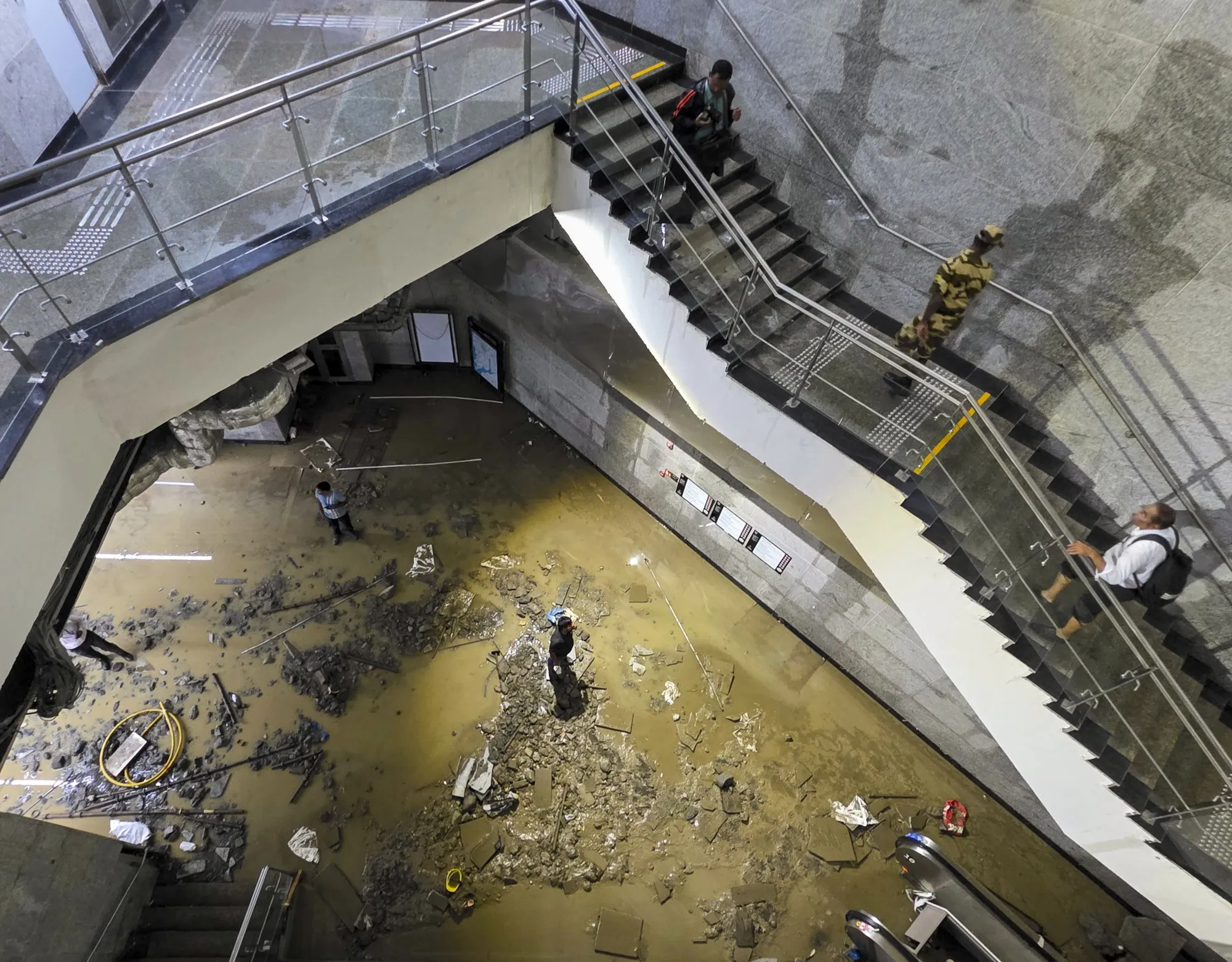 Acharya Atre Chowk underground metro station inundated during heavy rainfall, in Mumbai on May 26.