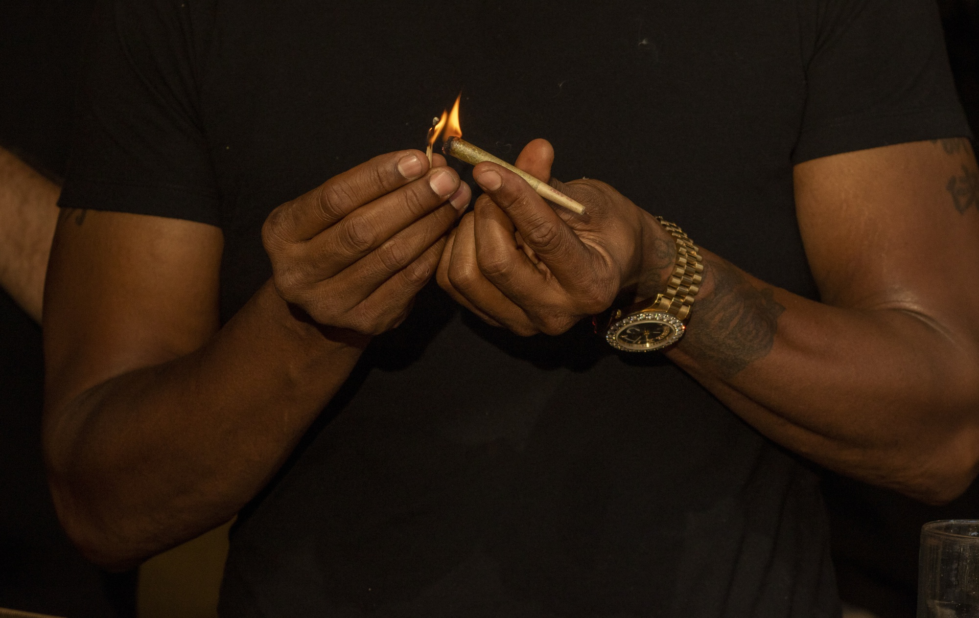 A customer lights a joint at a cannabis lounge in West Hollywood, California.