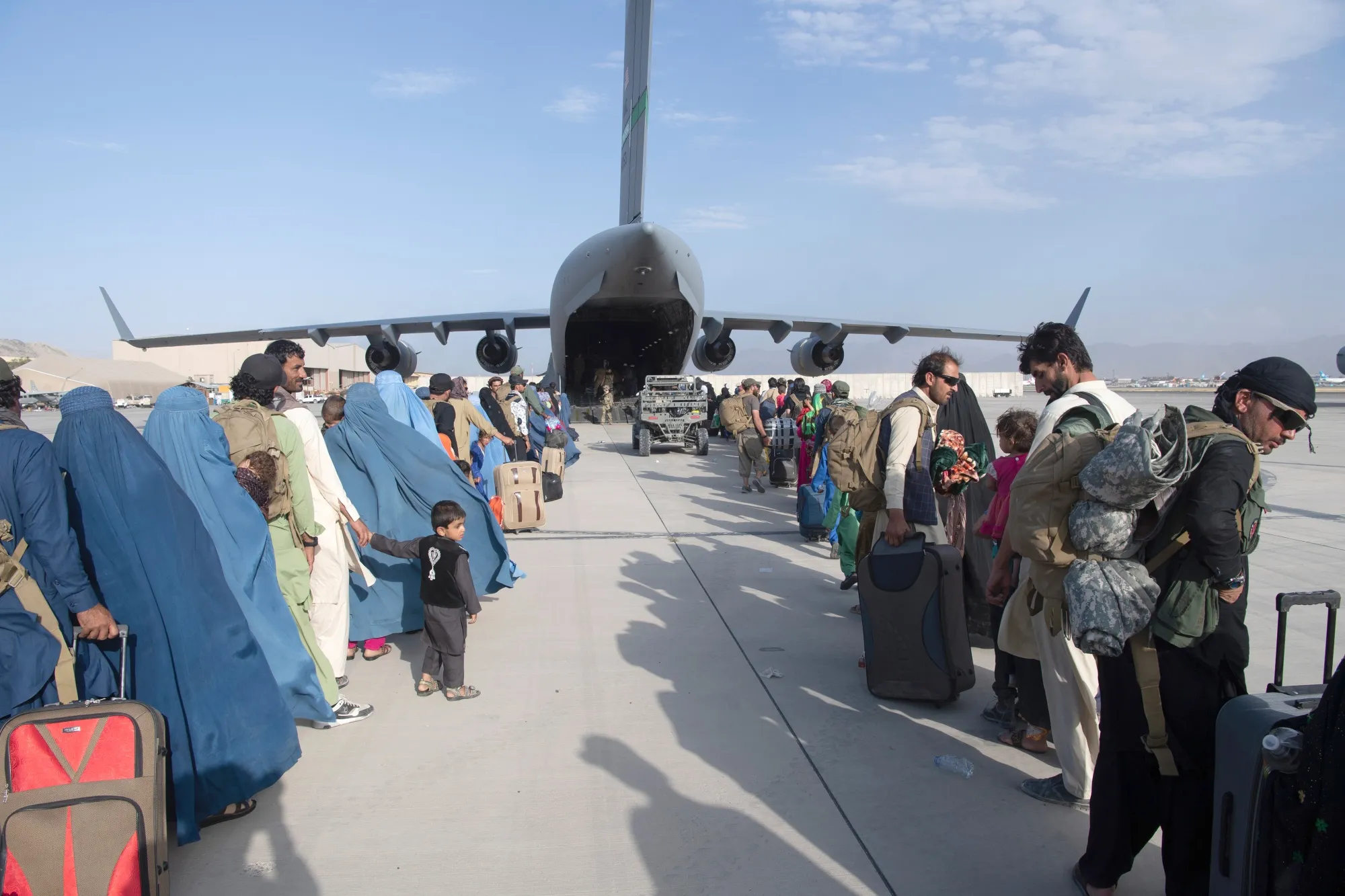 Evacuees embark a U.S. Air Force aircraft at&nbsp;Hamid Karzai International Airport in Kabul, Afghanistan, on Aug. 24.