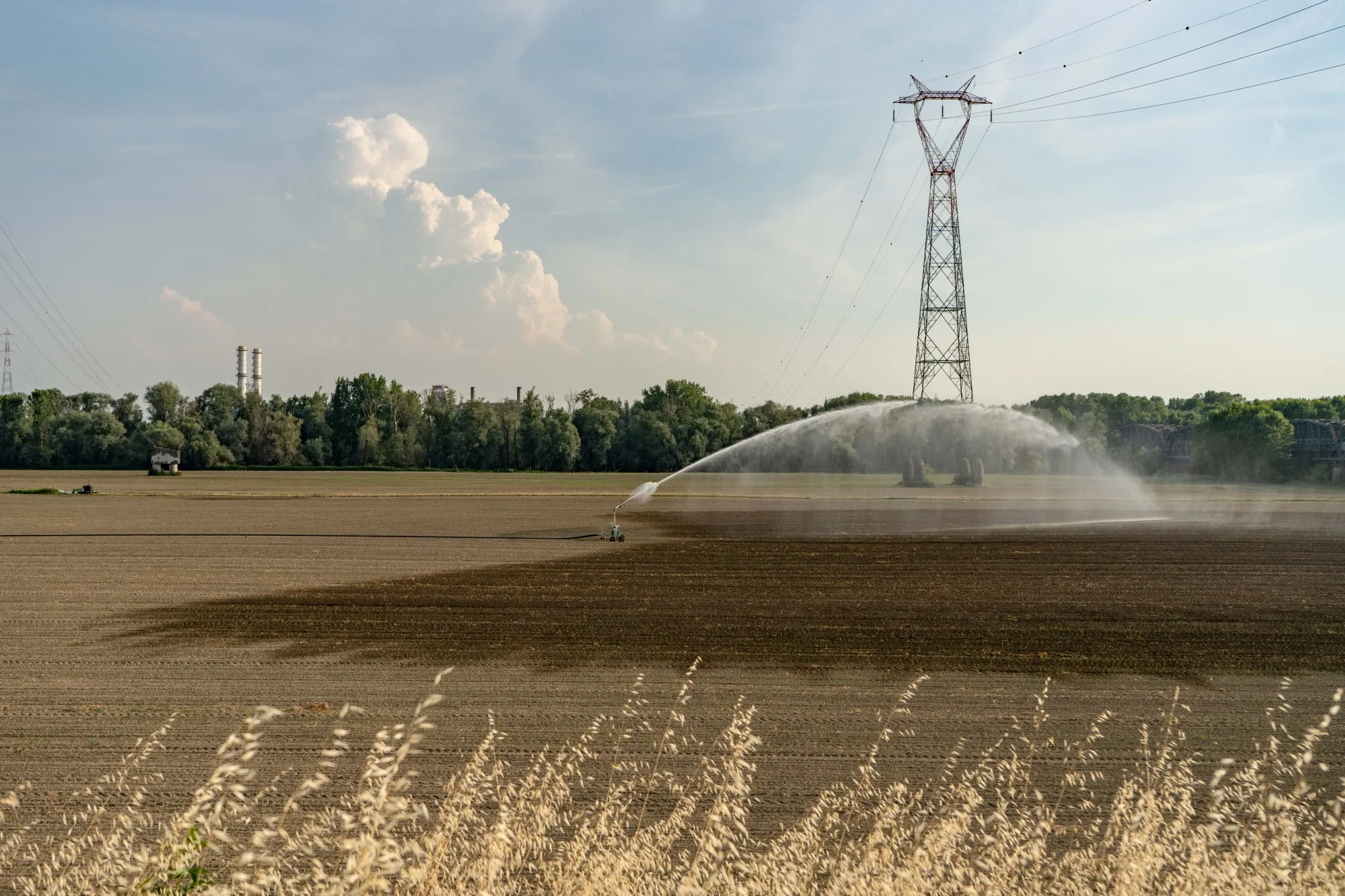 An irrigation system waters a&nbsp;field during a drought&nbsp;near Piacenza, Italy, in 2022.&nbsp;