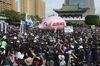 People hold a pig model "Betray pig farmers" written on it during a protest in Taipei, Taiwan, Nov. 22.