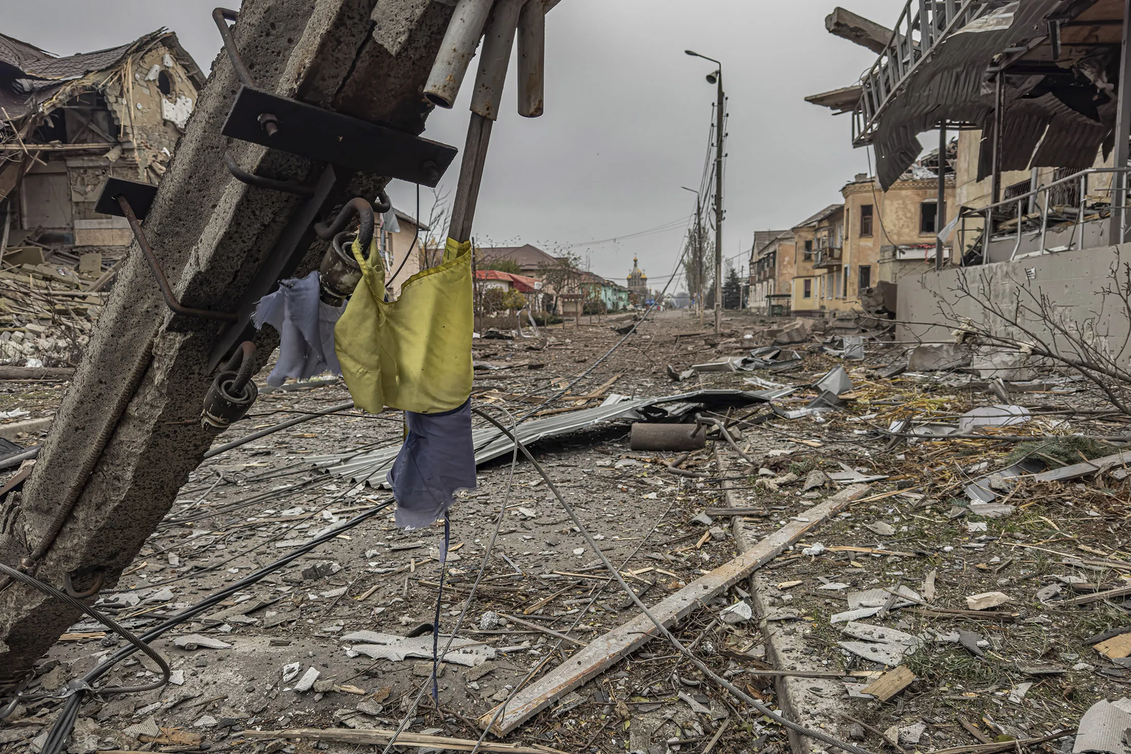 A central street&nbsp;covered in debris from destroyed residential buildings following&nbsp;Russian bombing in Kurakhove, Donetsk region, Ukraine, on Nov. 7.