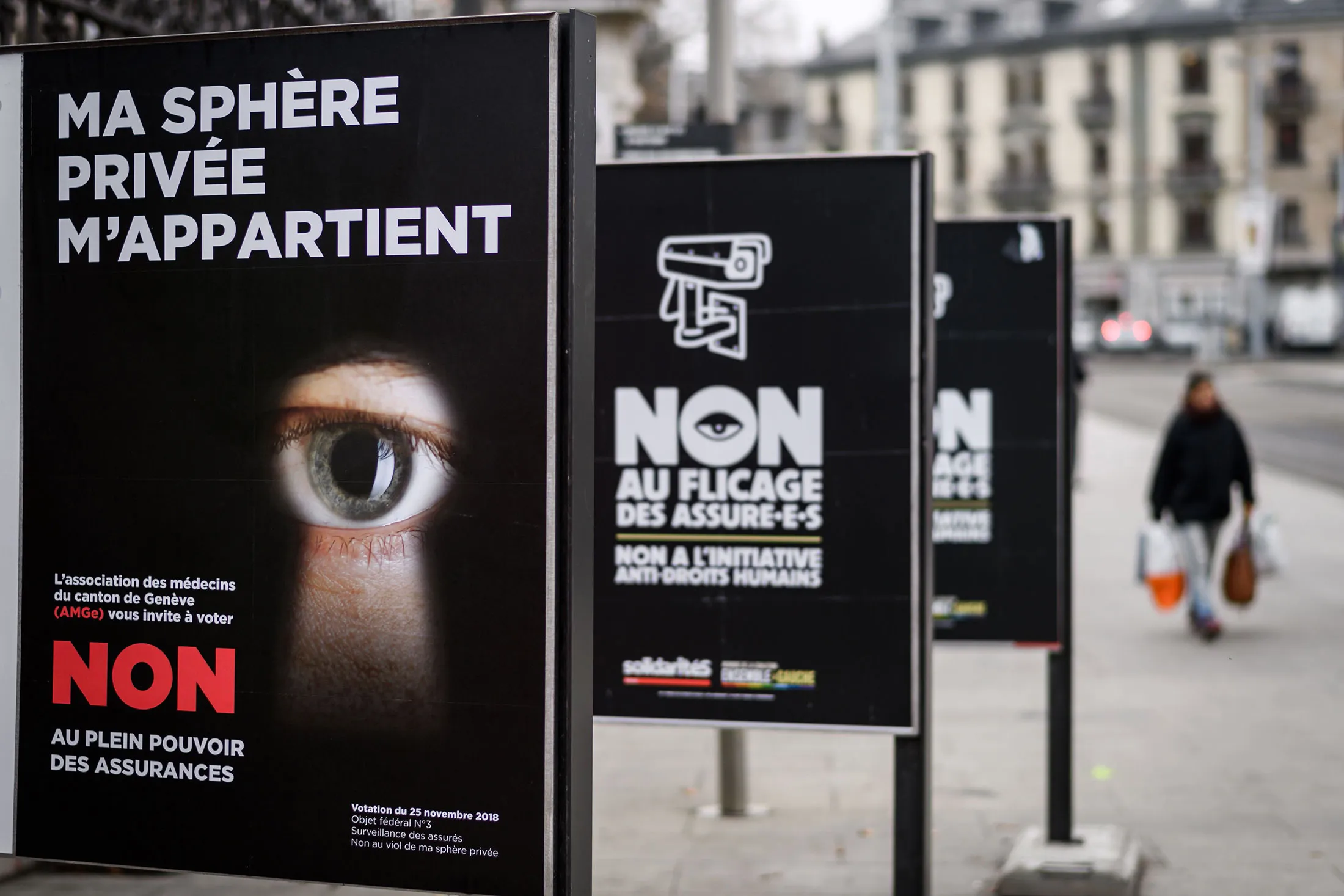 Campaign posters stand&nbsp;in a street in Geneva prior to a referendum in Switzerland.