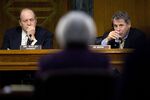Senator Richard Shelby, a Republican from Alabama and chairman of the Senate Banking Committee, left, and Senator Sherrod Brown, a Democrat from Ohio, right, listen as Janet Yellen, chair of the U.S. Federal Reserve, center, speaks during a Senate Banking Committee hearing in Washington, D.C., on Feb. 24, 2015. Yellen said inflation and wage growth remain too low even as the job market improves, and she signaled that a change in the Fed's guidance on interest rates won't lock it into a timetable for tightening.

