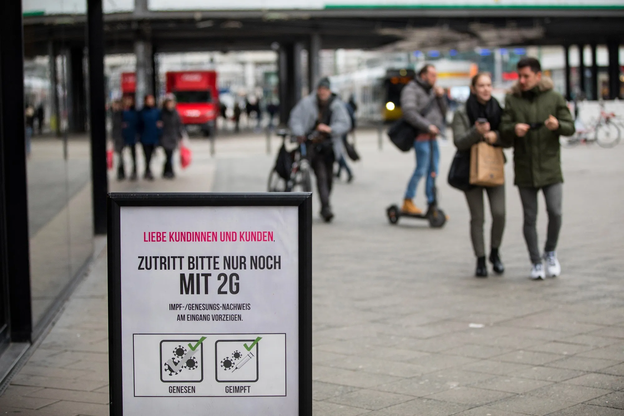 A sign advising the requirement of 2G, a Covid-19 vaccine or recovery proof, outside a store on Alexanderplatz in central Berlin.