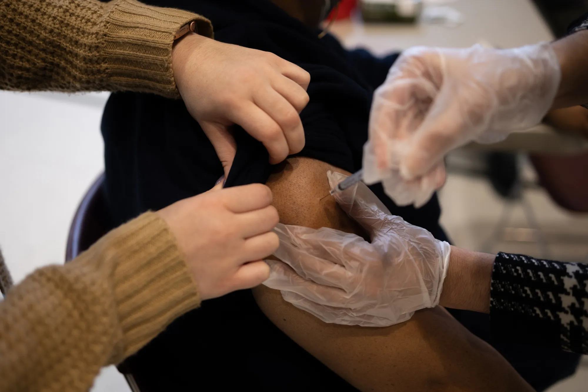 A resident receives a Covid-19 booster shot at a vaccine clinic in Lansdale, Pennsylvania.