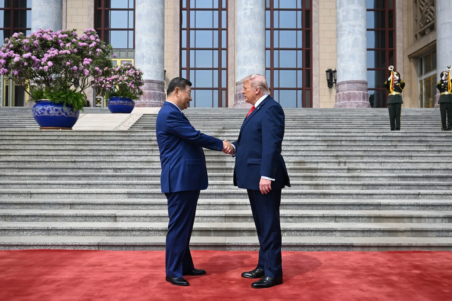 President Donald Trump is greeted by Chinese President Xi Jinping at the Great Hall of the People in Beijing on May 14.