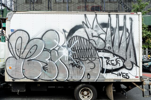 Crowned face painted on the side of a truck at East 149th Street and Courtland Avenue, Bronx
