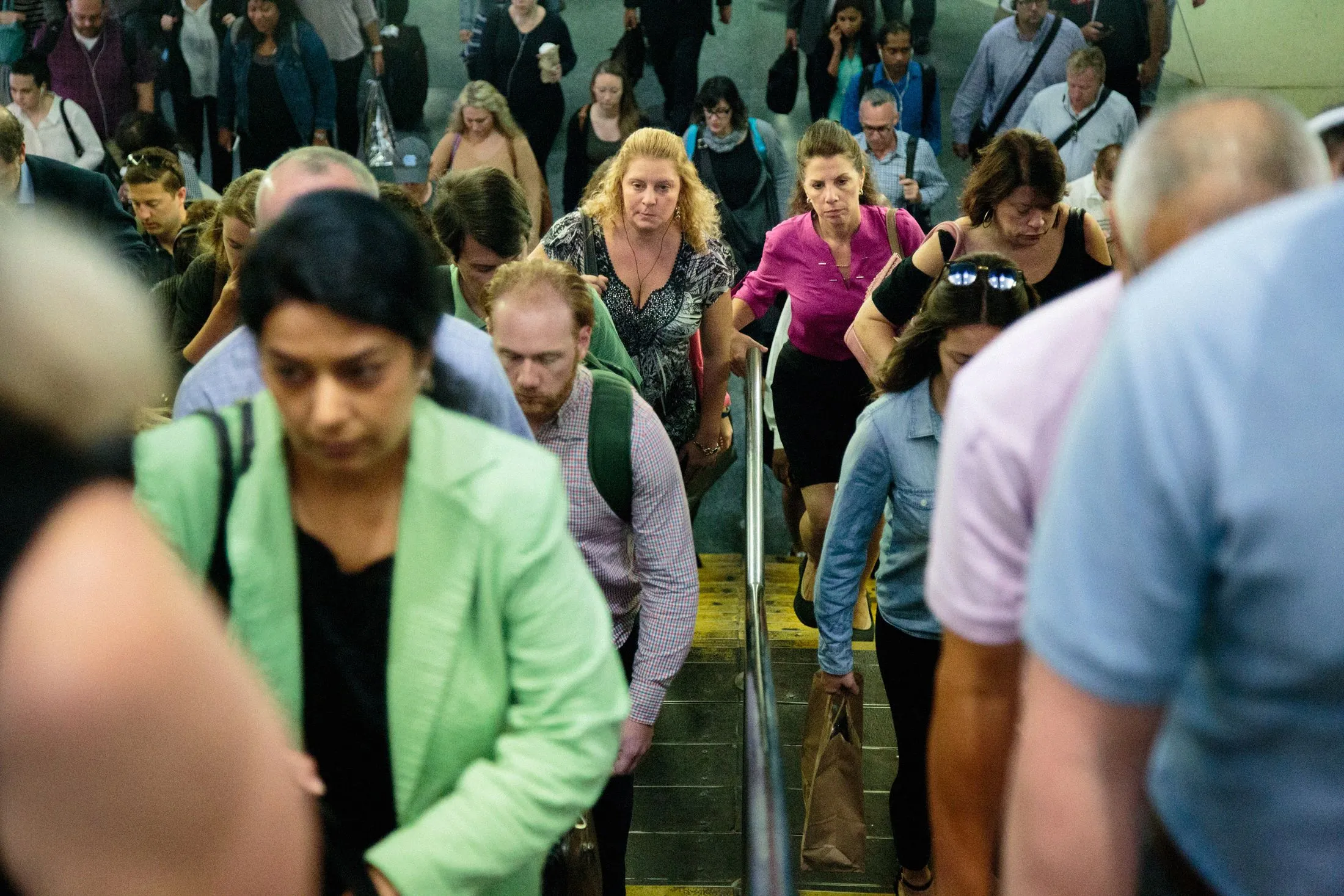 Commuters exit Penn Station.