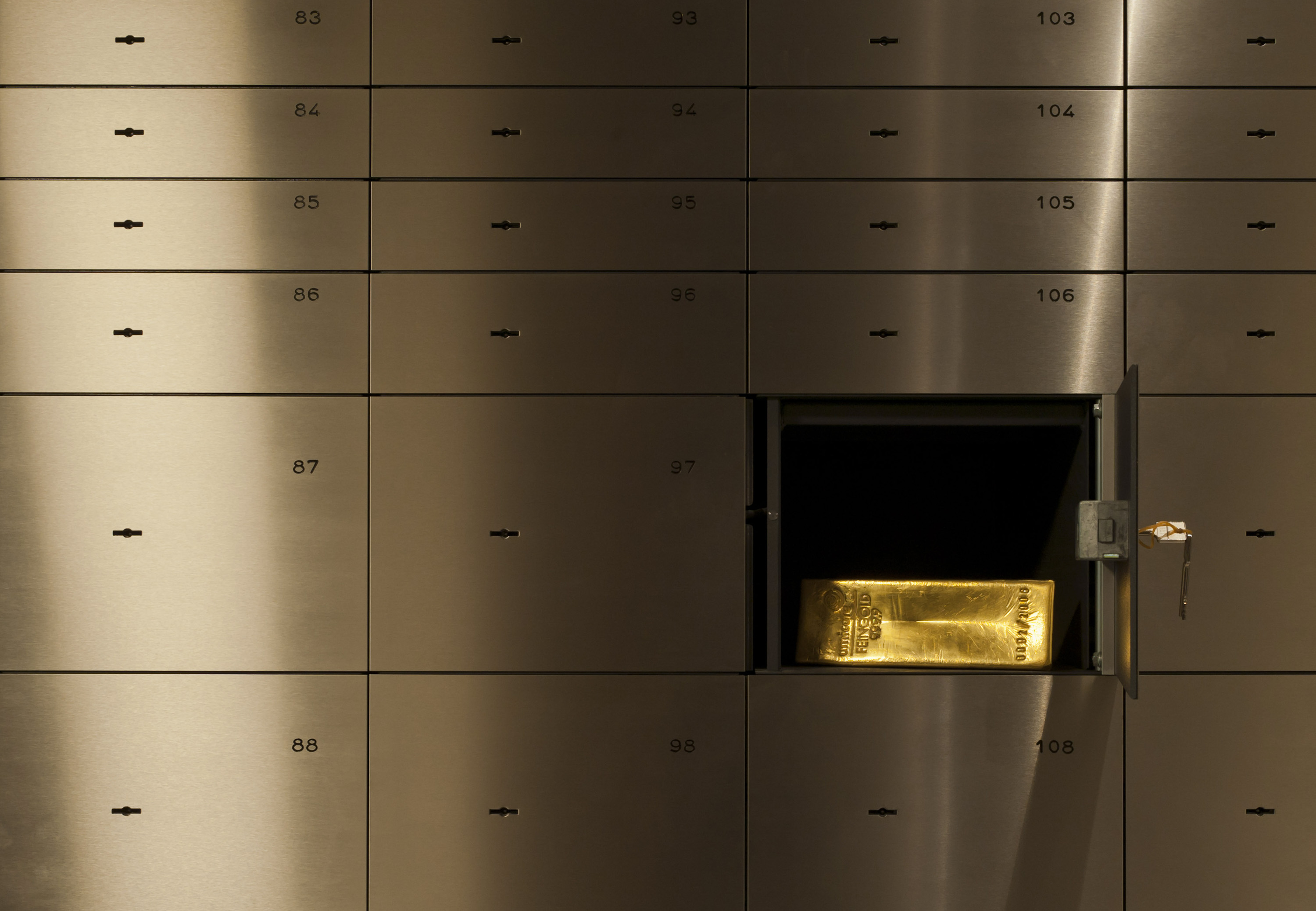 A gold bar weighing 12.5 kilograms sits inside a deposit box in the vault of gold vendor ProAurum in Munich, Germany, on Tuesday, Aug. 23, 2011. Gold advanced to an all-time high above $1,910 as investors sought to protect their wealth against financial turmoil amid speculation that the global economy is slowing.