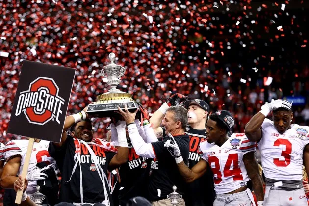Head coach Urban Meyer and the Ohio State Buckeyes celebrate with the trophy after defeating the Alabama Crimson Tide in the All State Sugar Bowl at the Mercedes-Benz Superdome on January 1, 2015 in New Orleans.