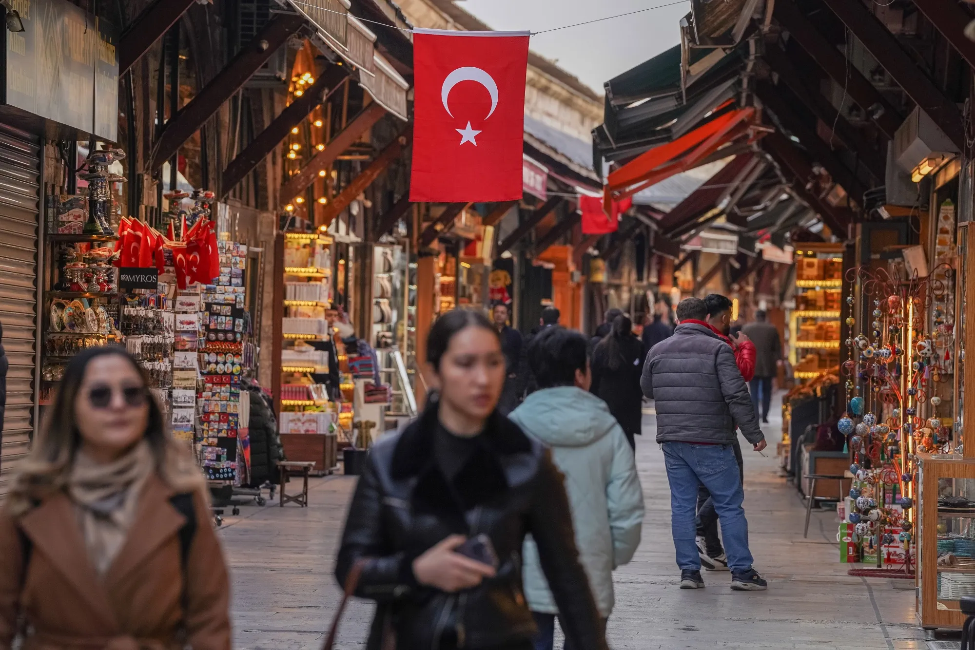 A Turkish national flag hangs above the Arasta Bazaar in Istanbul, Turkey.