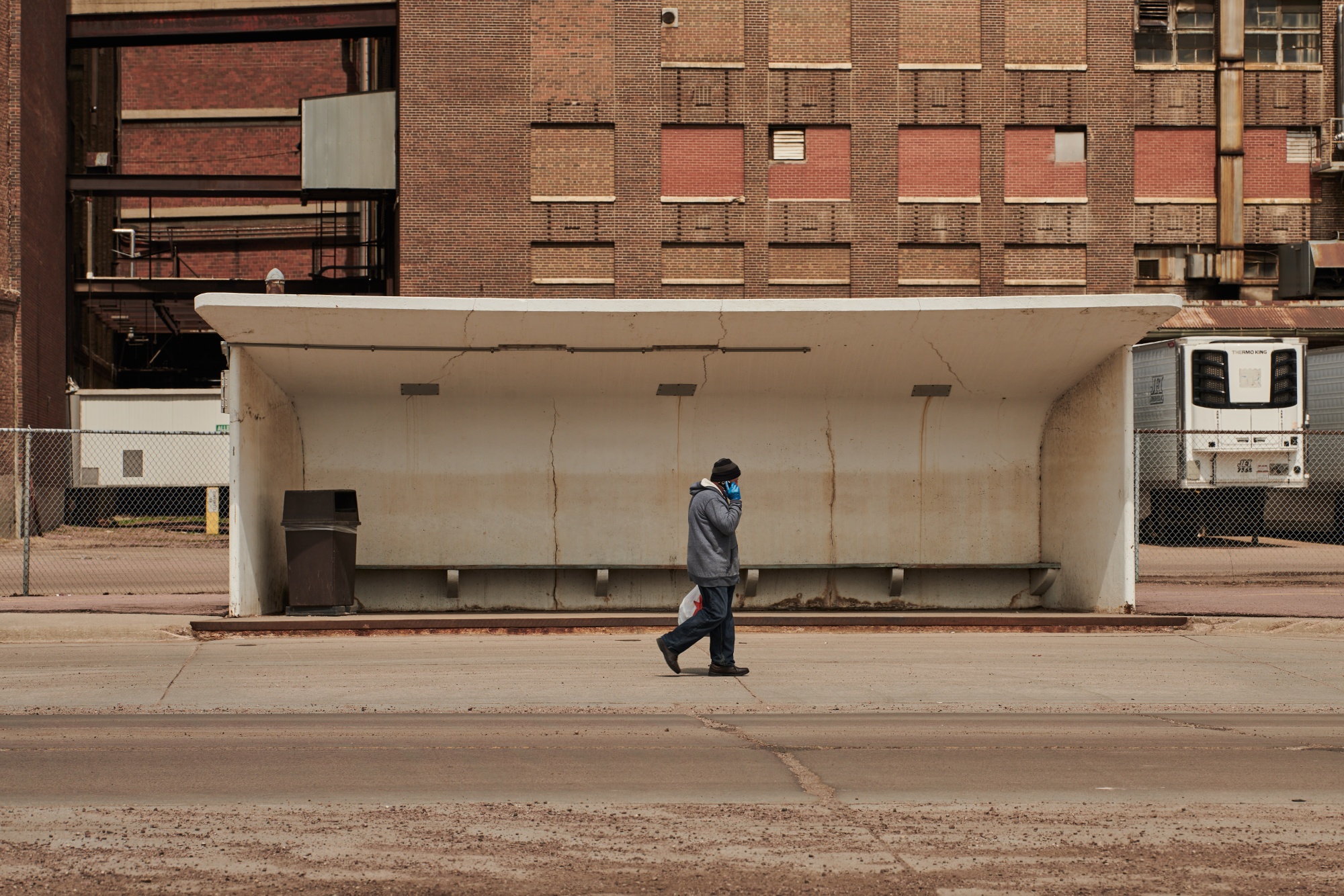 A pedestrian walks outside the closed Smithfield Foods Inc. plant in Sioux Falls, South Dakota, U.S., on April 15.