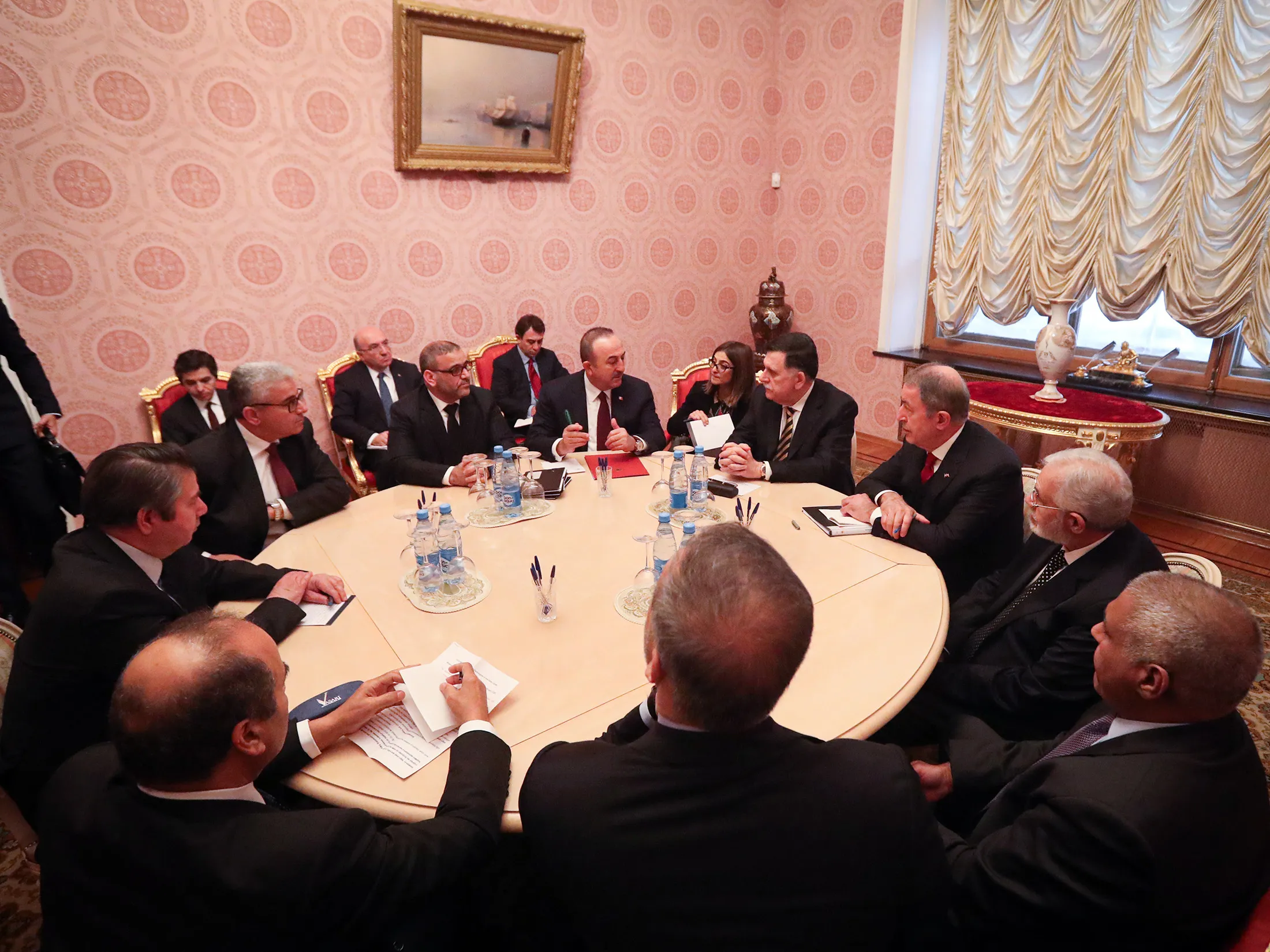 Libya’s UN-recognized prime minister, Fayez al-Sarraj, fouth right, speaks with Turkish officials in Moscow, on Jan. 13.