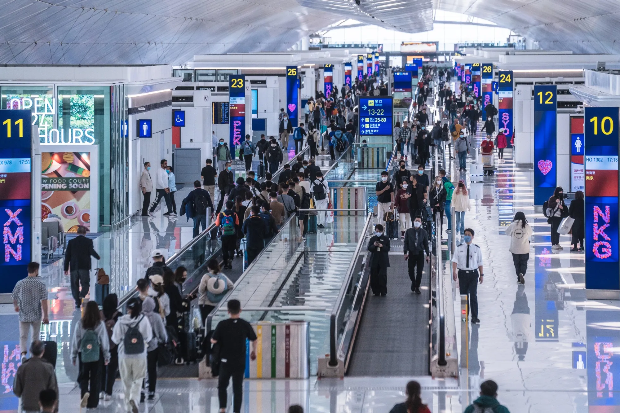 Travelers at Hong Kong International Airport.
