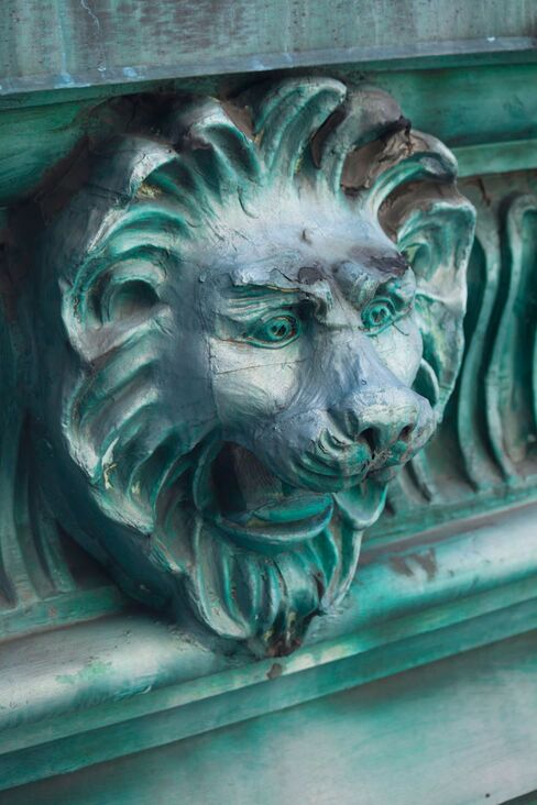 Copper lion heads, restored from the original 1906 Knickerbocker hotel, line St. Cloud's Beaux-Arts facade.