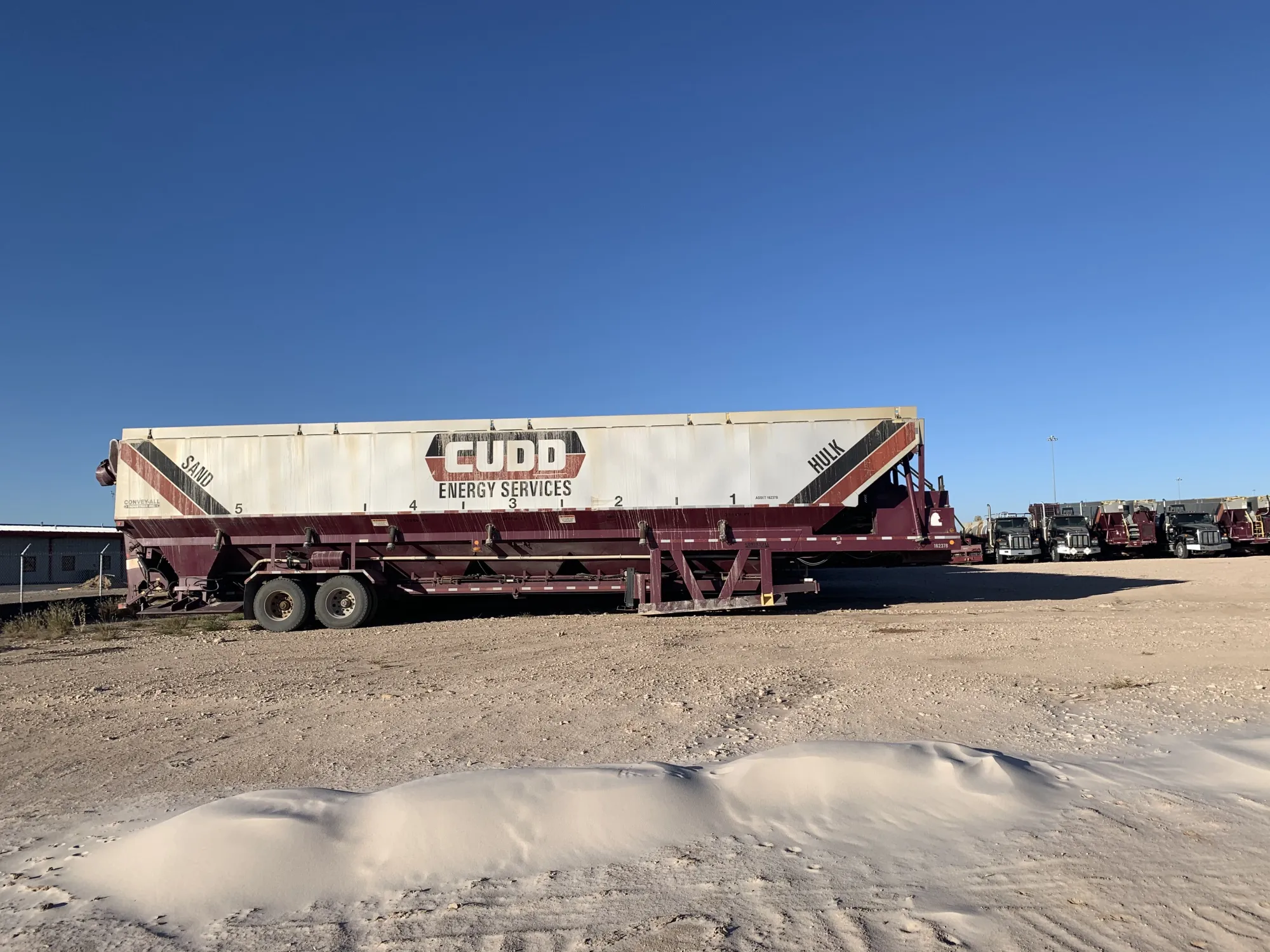 A sand-hauling truck sits in a Cudd Energy lot in Odessa, Texas.