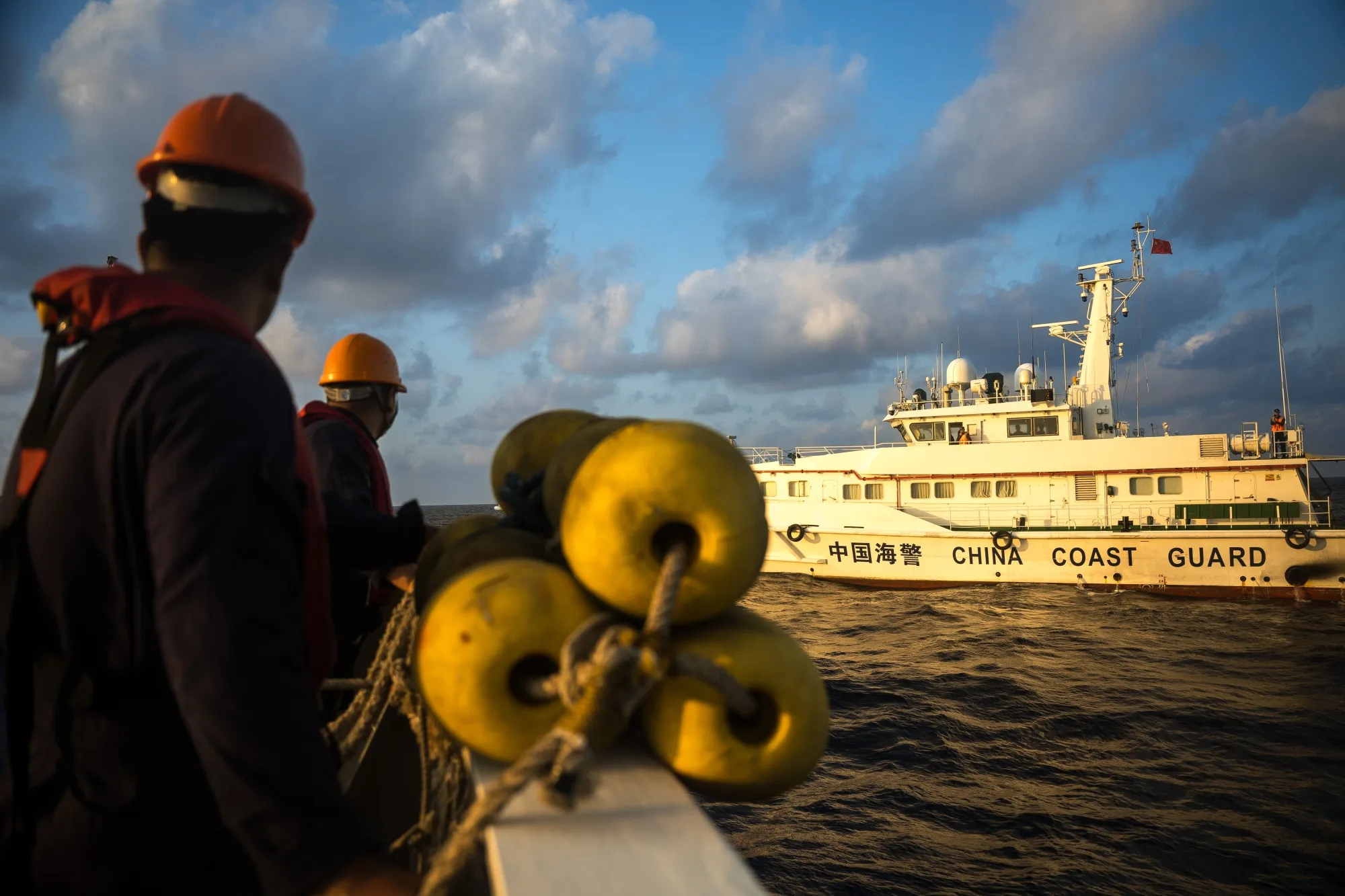 A China coast guard ship blocks the Philippine vessel BRP Sindangan from reaching Unaizah May 4, a Philippine Navy-chartered vessel, in South China Sea on March 23.