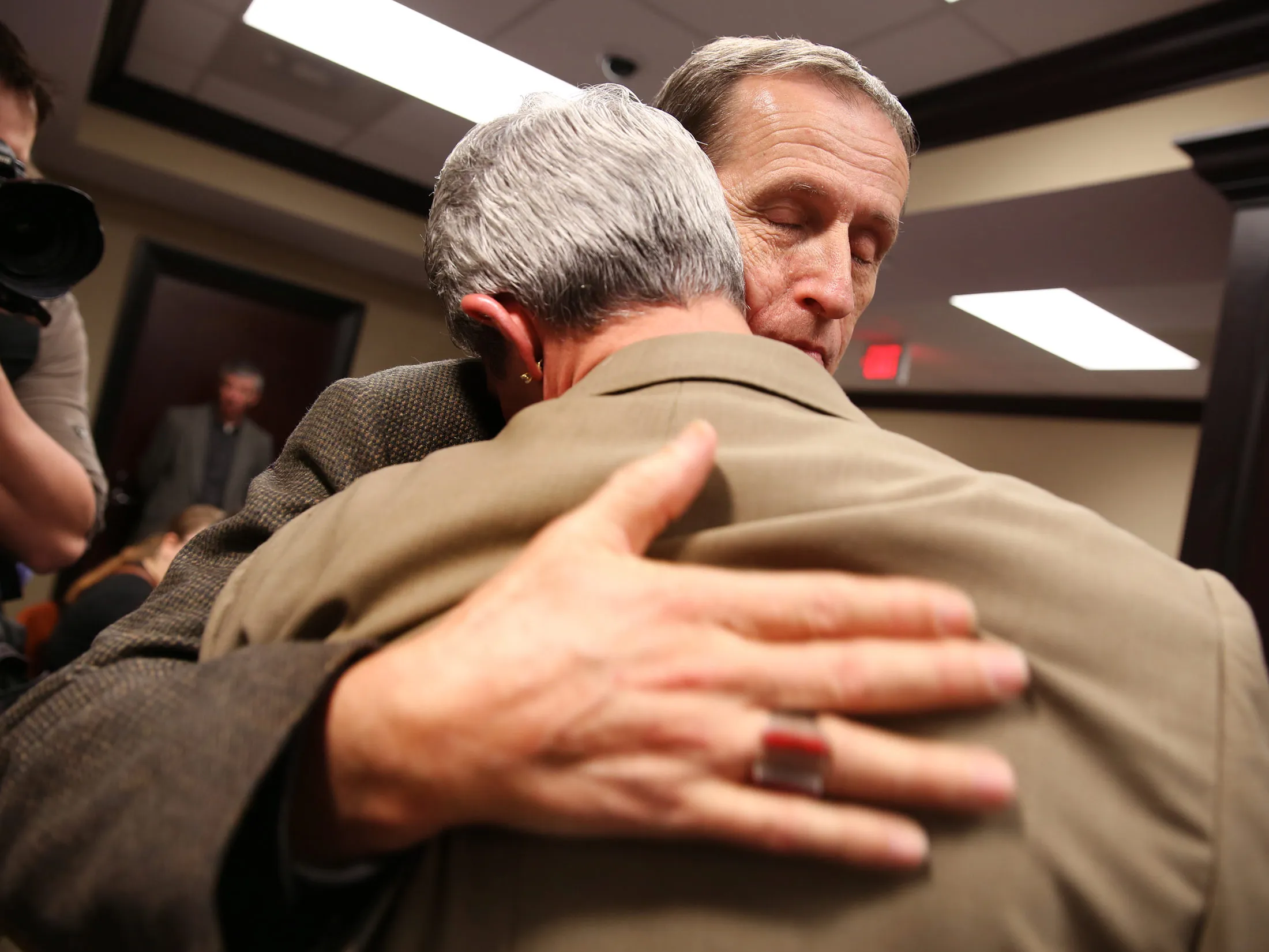 Robert Povilat, left, and Milton Persinger wait with dozens of people in the Mobile County Probate office in Mobile, Alabama on Feb. 9, 2015.
