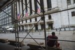 A person sits on a bench outside the New York Stock Exchange&nbsp;in New York..