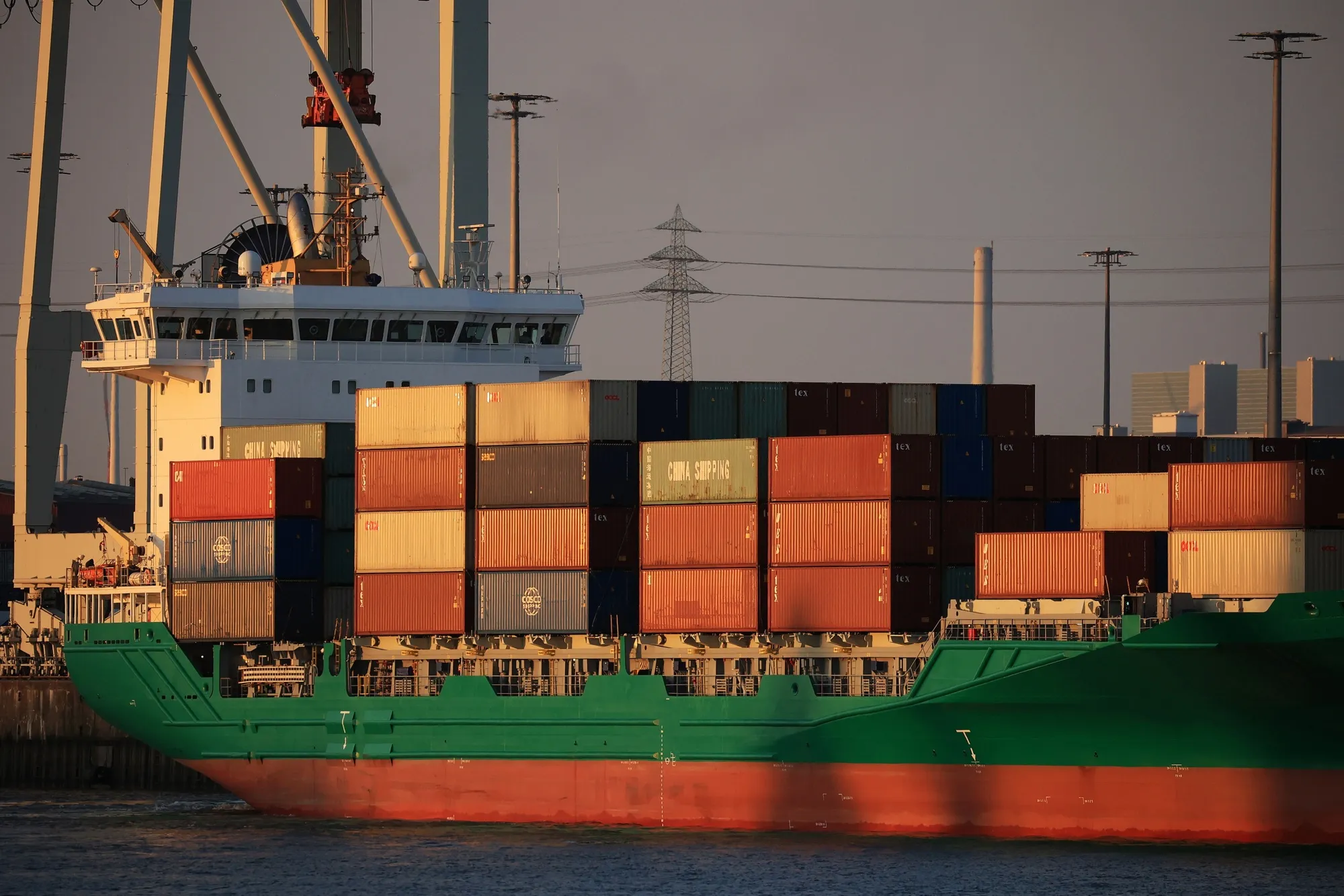 A container ship docking at the Port of Hamburg.