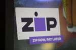 A Zip Co. sticker outside a retail store in Sydney, Australia.